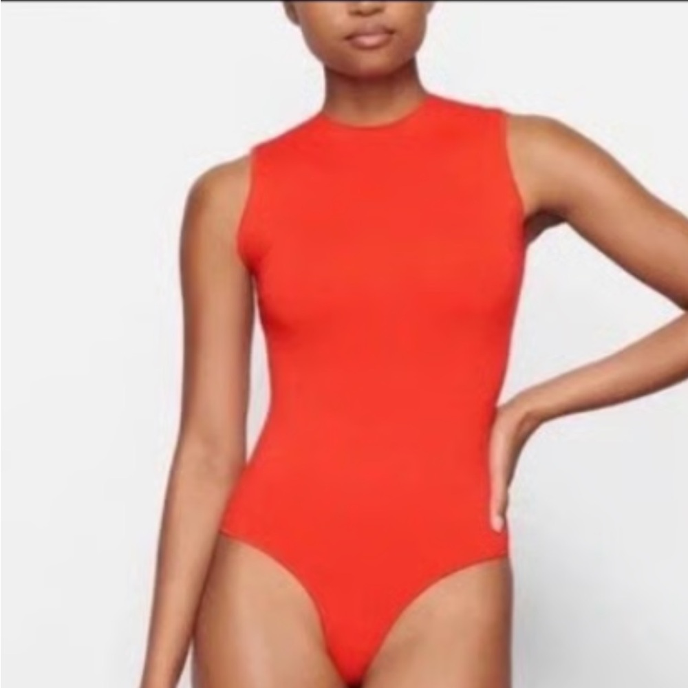 NWT Skims Women’s jelly sheer bodysuit in the color Poppy in size Medium